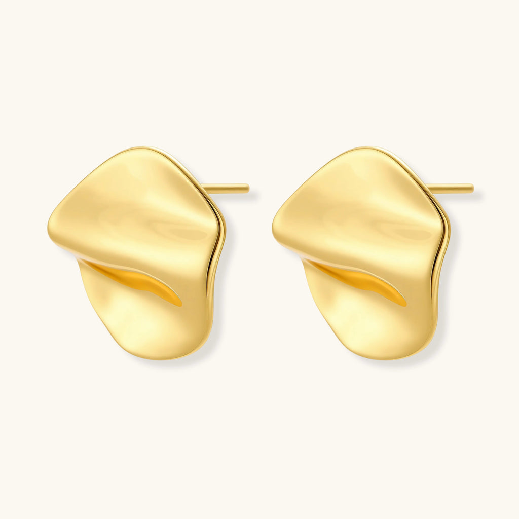 Gold sculptural stud earrings with flowing design
