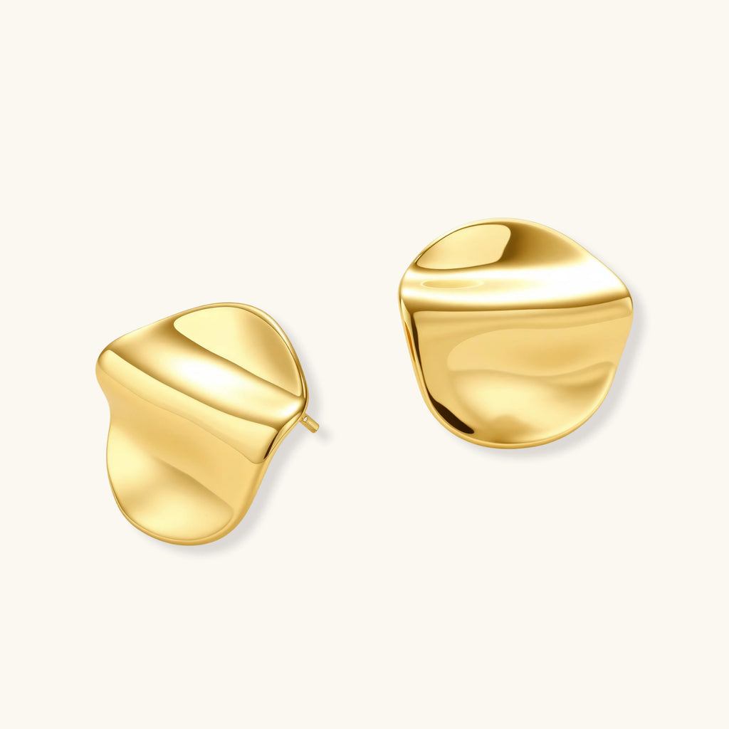 Gold sculptural stud earrings with flowing design