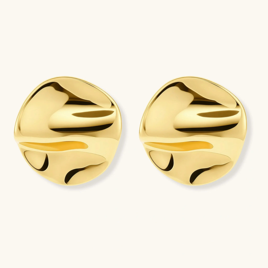 Gold sculptural stud earrings with flowing design