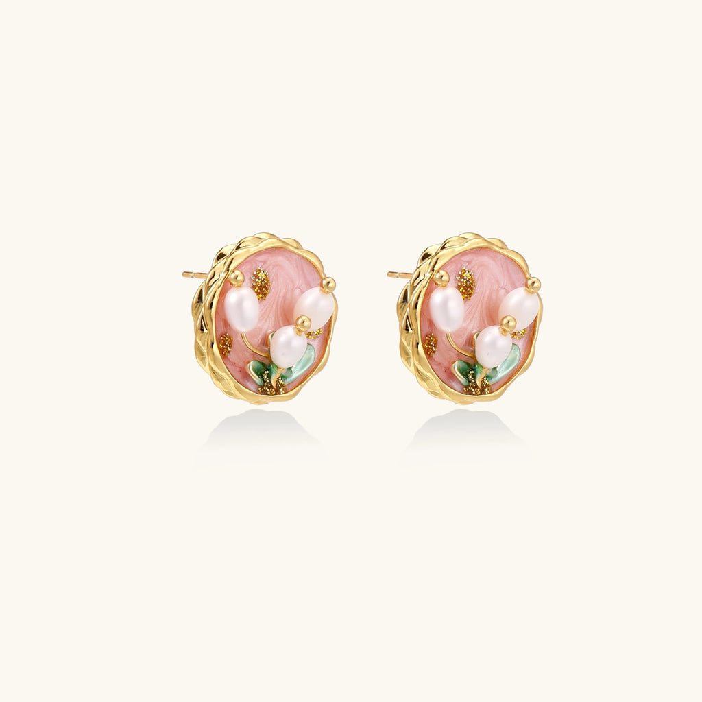 Gold flower stud earrings with pearl center