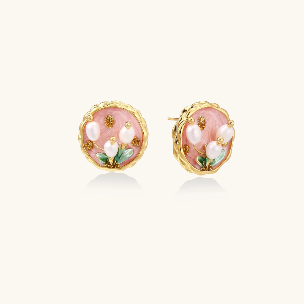 Gold flower stud earrings with pearl center