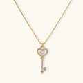 Gold heart and key pendant necklace on fine chain