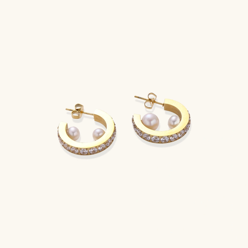 Gold hoop earrings with pavé stars and freshwater pearl drops