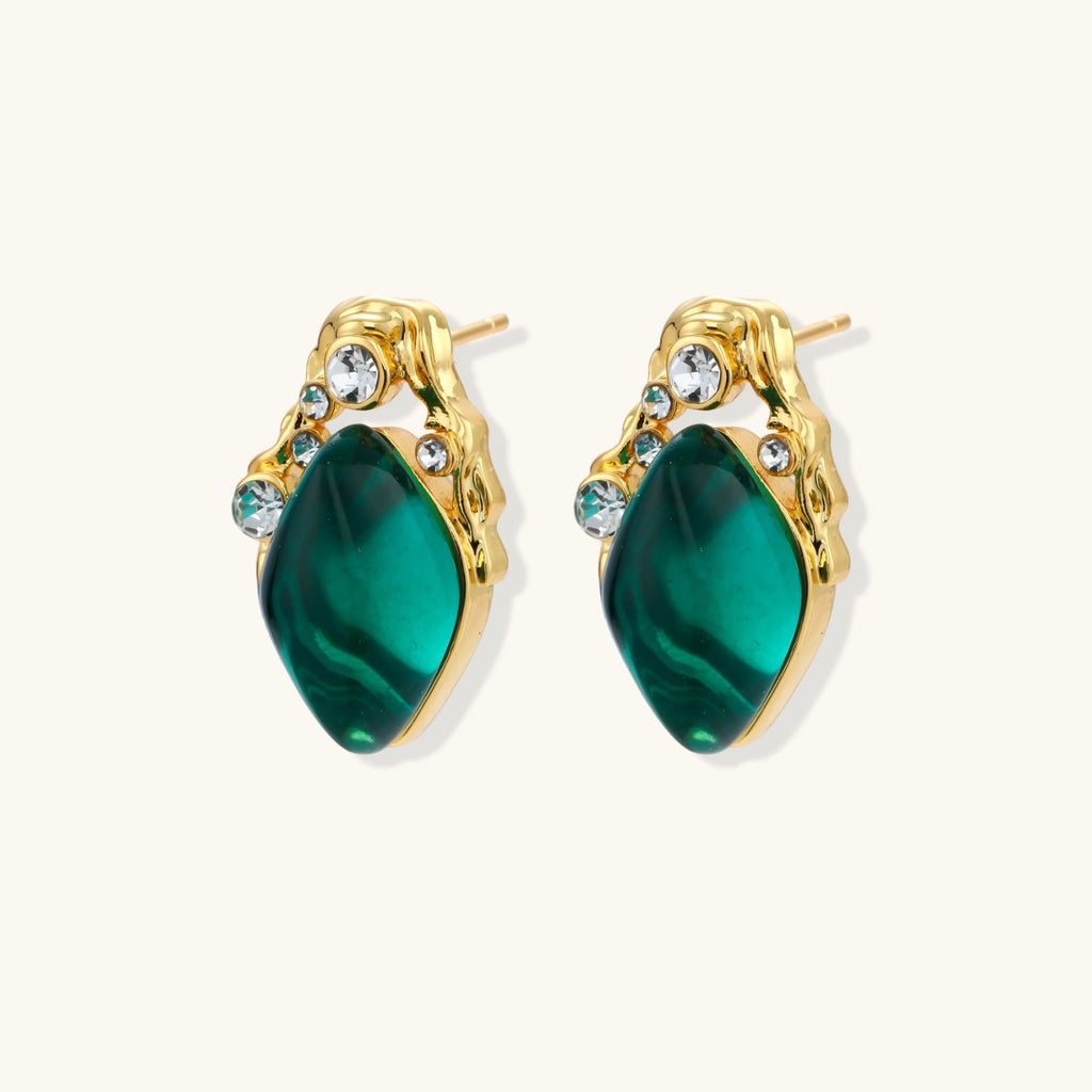 Gold stud earrings with emerald-cut green stone