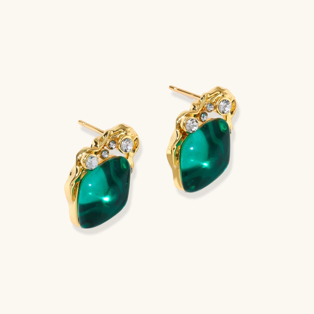 Gold stud earrings with emerald-cut green stone
