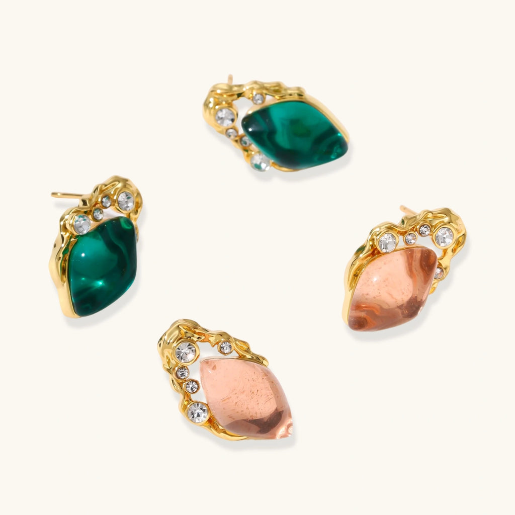 Gold stud earrings with emerald-cut green stone