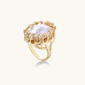 Gold crown-motif ring with pavé crystal band