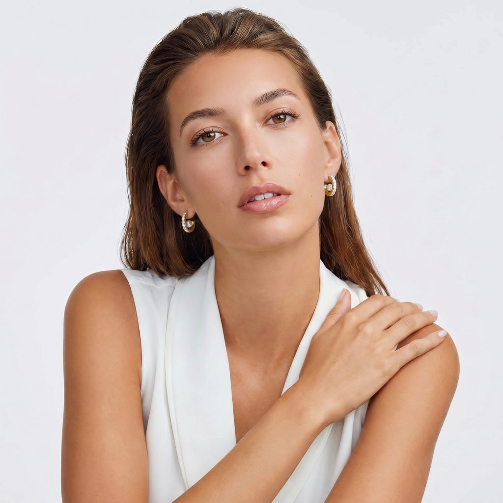 Gold hoop earrings with pavé stars and freshwater pearl drops