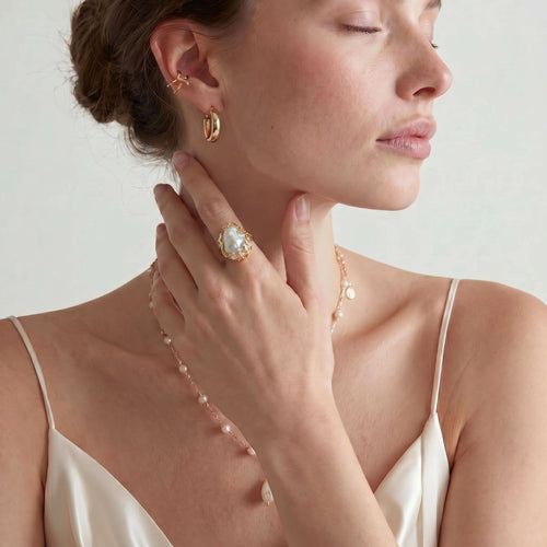Gold crown-motif ring with pavé crystal band